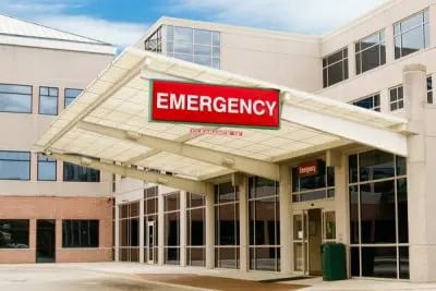 Image of hospital with emergency sign