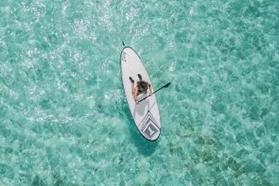 Overhead view of a woman on a paddleboard