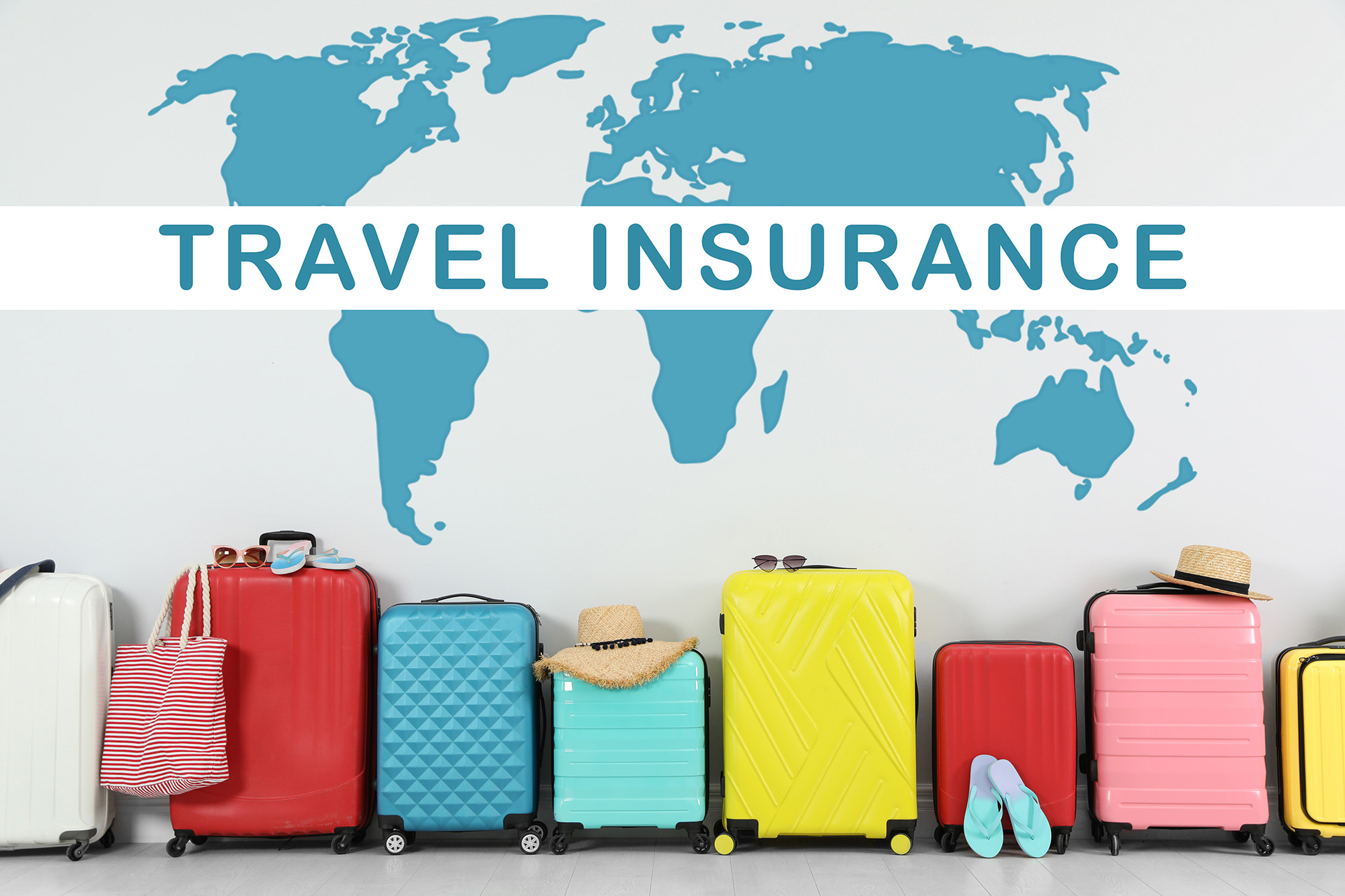 Colorful suitcases and phrase TRAVEL INSURANCE on light backgrou